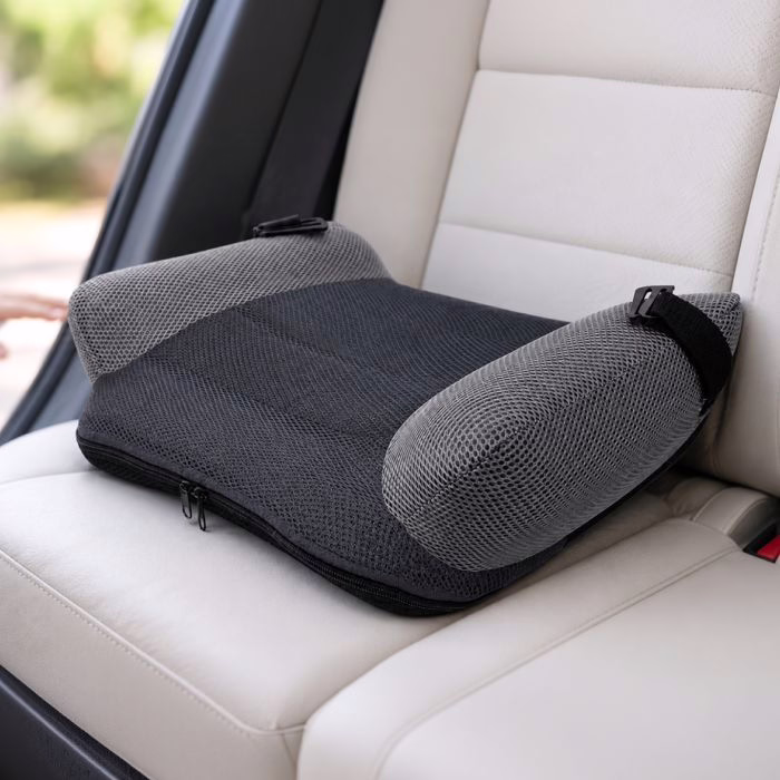 The inflated BubaBoost booster sitting flat on the light coloured back seat of a car